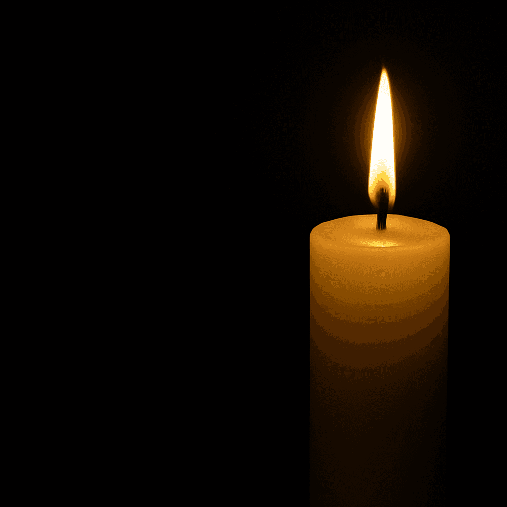 Single candle in the dark